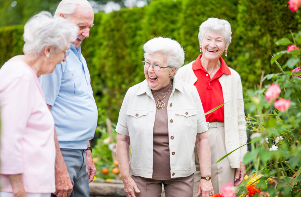 image of seniors laughing while walking at Modesto assisted living facility